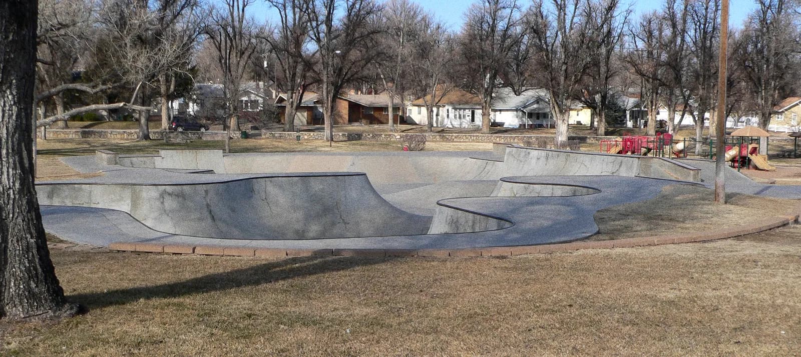 An empty skatepark bowl in flat winter light
