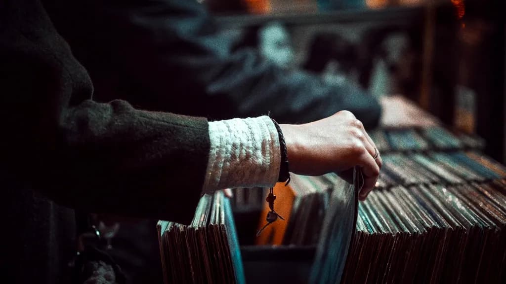 Hands flipping through a crate of records